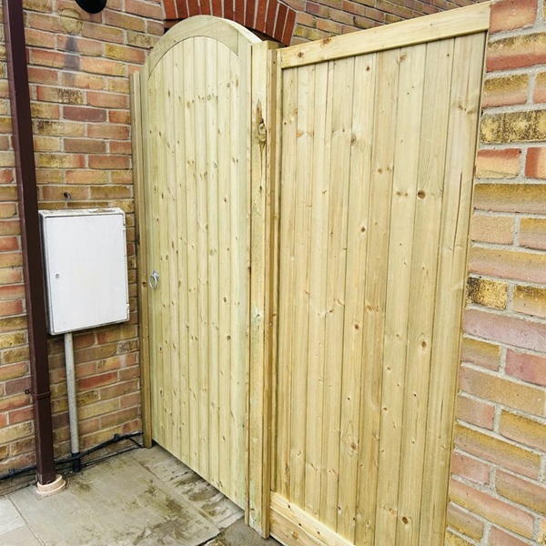 Framed arch top TGV gate with flat top side panel
