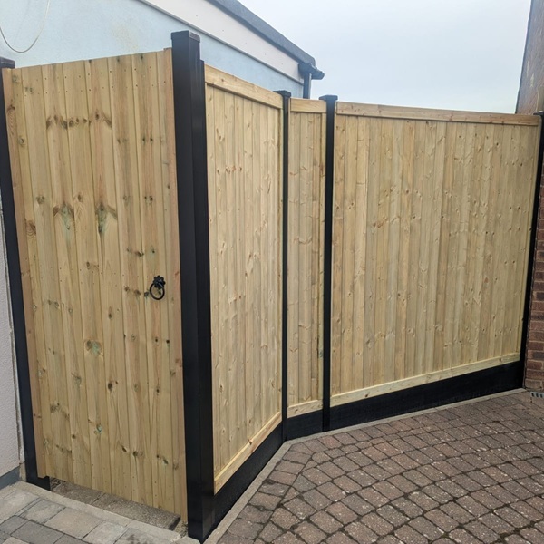 Adjustable steel gate frame with Black DuraPosts and Tongue & Groove Fencing with Prima boards