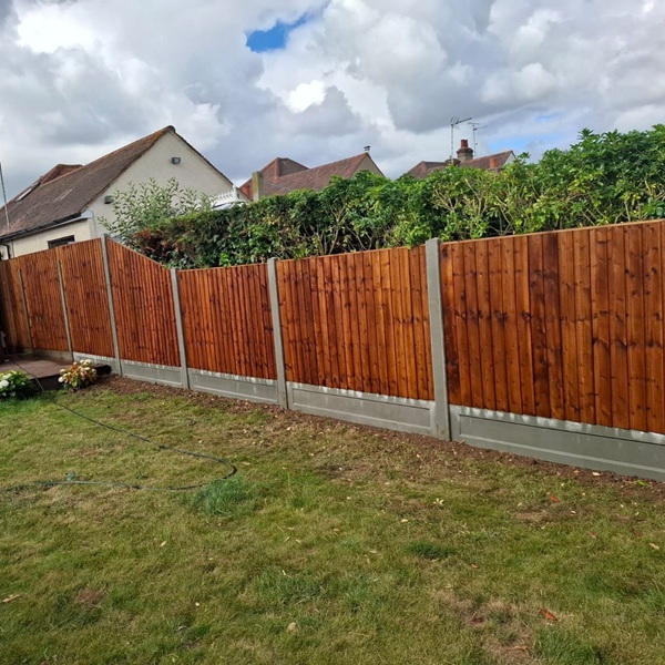 Trade Feather Edge Panels with concrete posts and gravel boards
