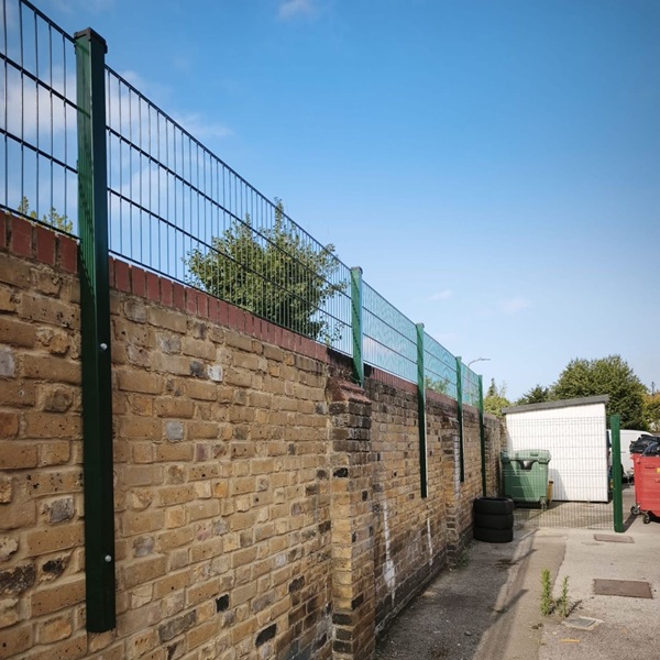 Twin Wire Mesh fencing posts bolted to wall